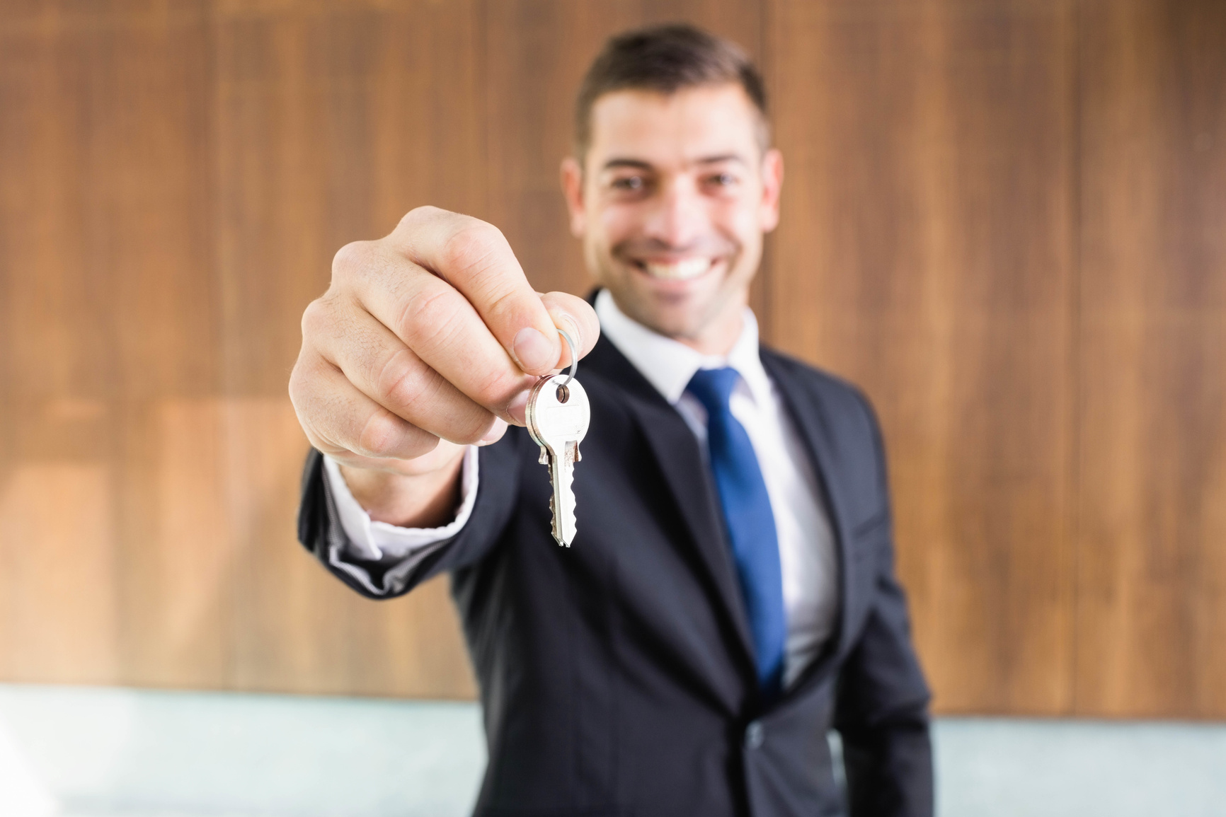 Real-estate agent giving keys